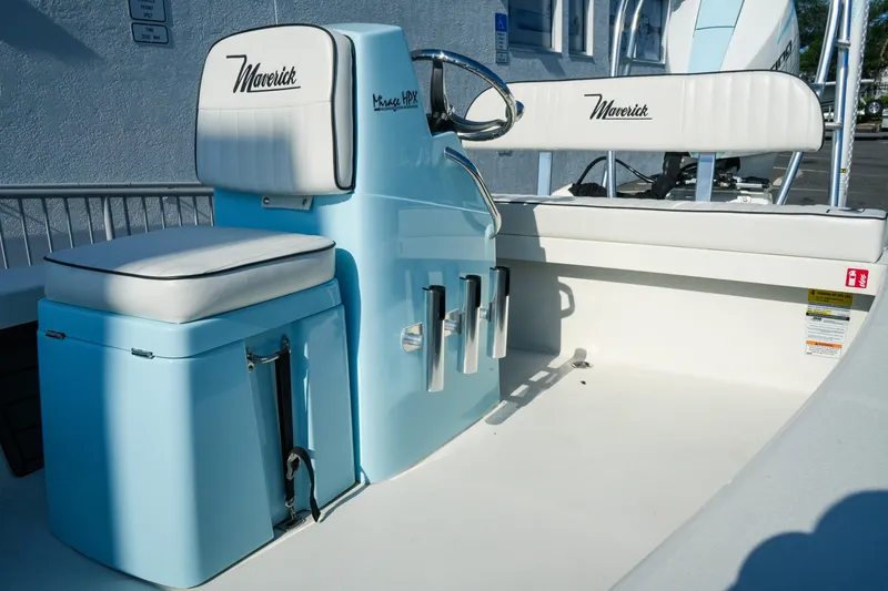 Slide: The Image of 2027 Maverick Mirage 18 HPX-V boat interior with blue and white seating and console. - 22