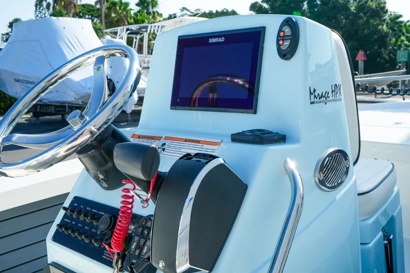 Slide: The Image of 2027 Maverick Mirage 18 HPX-V boat console with steering wheel and navigation display. - 31