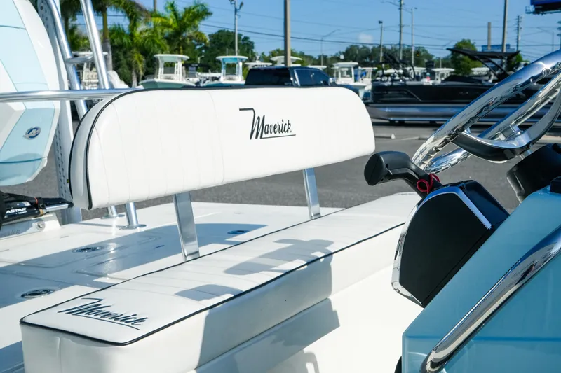 Slide: The Image of 2027 Maverick Mirage 18 HPX-V boat interior with white seating and steering wheel. - 28