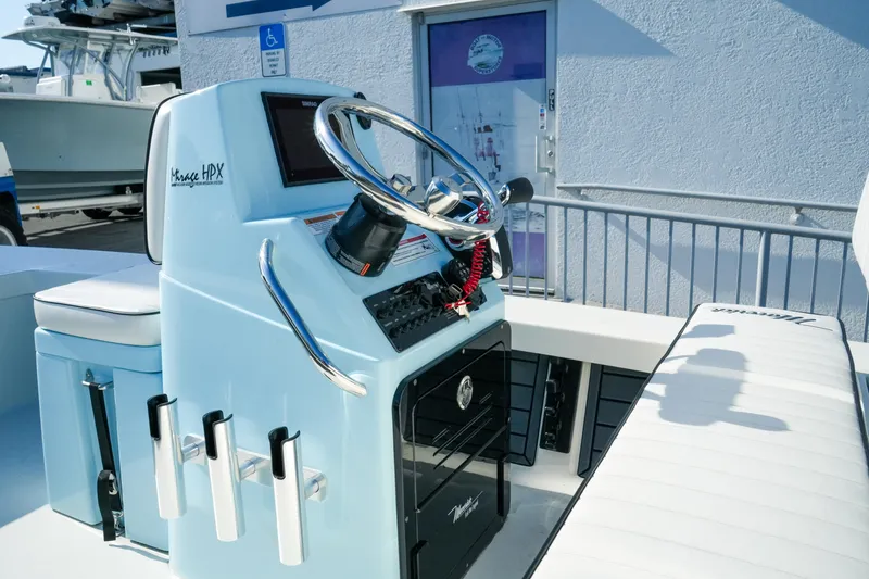 Slide: The Image of 2027 Maverick Mirage 18 HPX-V boat console with steering wheel and controls. - 17