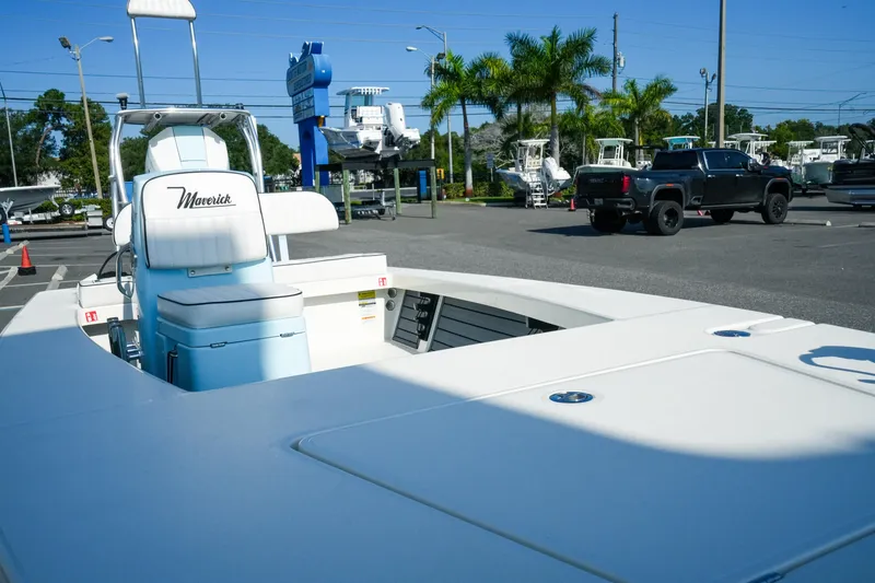 Slide: The Image of 2027 Maverick Mirage 18 HPX-V boat displayed in a sunny outdoor showroom. - 23