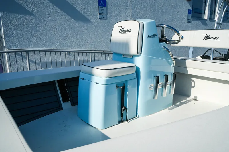 Slide: The Image of 2027 Maverick Mirage 18 HPX-V boat interior with blue console and seating. - 21