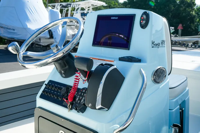 Slide: The Image of Steering console of 2027 Maverick Mirage 18 HPX-V boat with modern controls and display. - 34