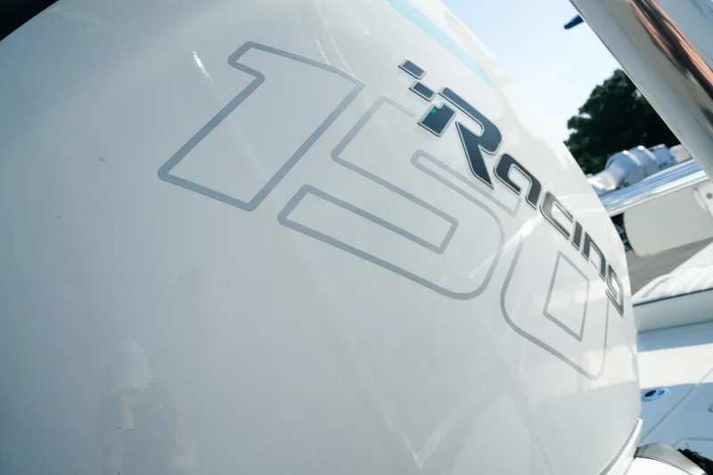Slide: The Image of Close-up of 2027 Maverick Mirage 18 HPX-V boat engine with "150 Racing" decal. - 9
