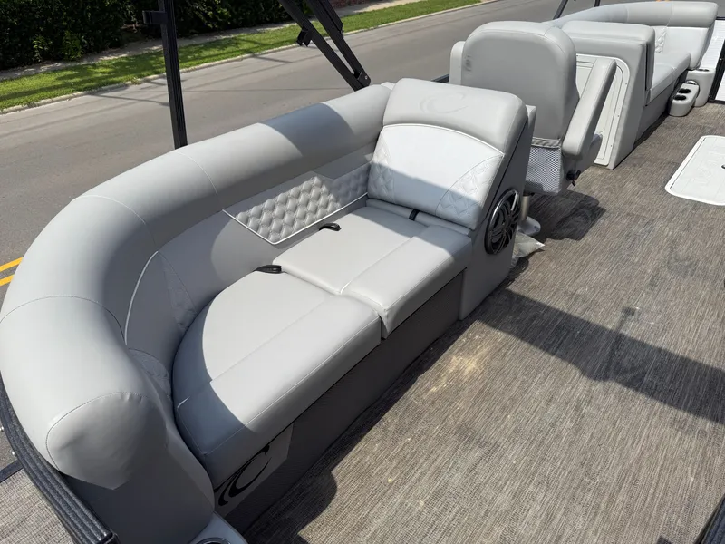 Slide: The Image of The image shows a luxurious gray seating area on a boat with cushioned upholstery. - 10