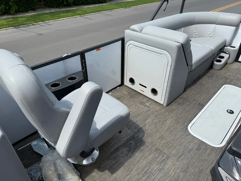 Slide: The Image of The image shows the interior of a 2022 Crest Classic Platinum 220 SLC with gray seating. - 7