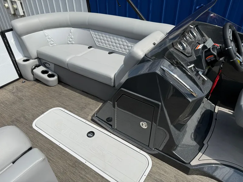 Slide: The Image of The image shows the cockpit of a 2022 Crest Classic Platinum 220 SLC with gray upholstery. - 5
