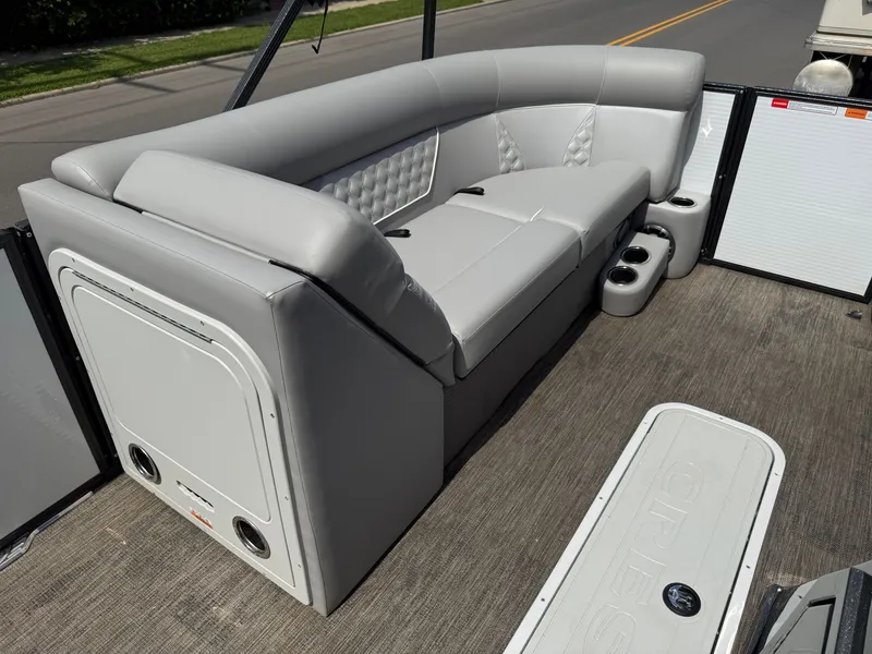 Slide: The Image of The image shows a luxurious gray seating area on a boat with cup holders. - 6