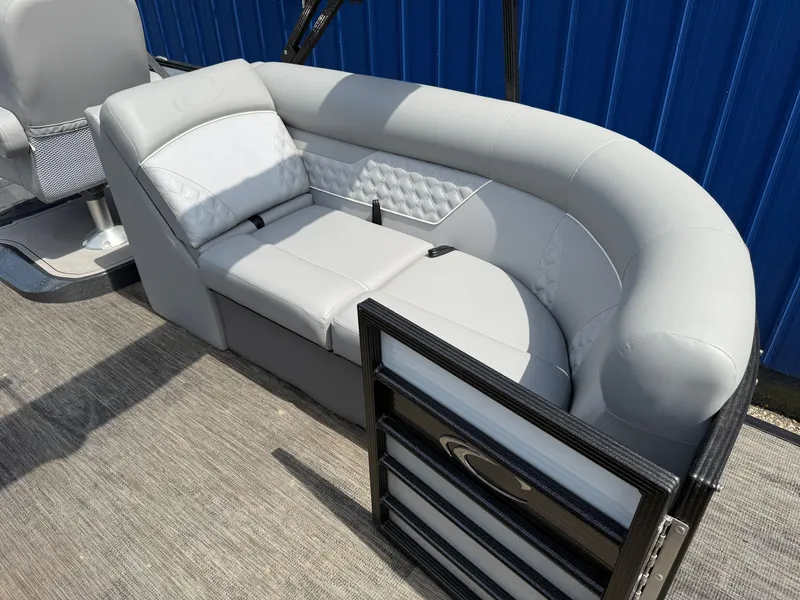 Slide: The Image of The image shows a luxurious gray seating area on a boat with blue walls in the background. - 11