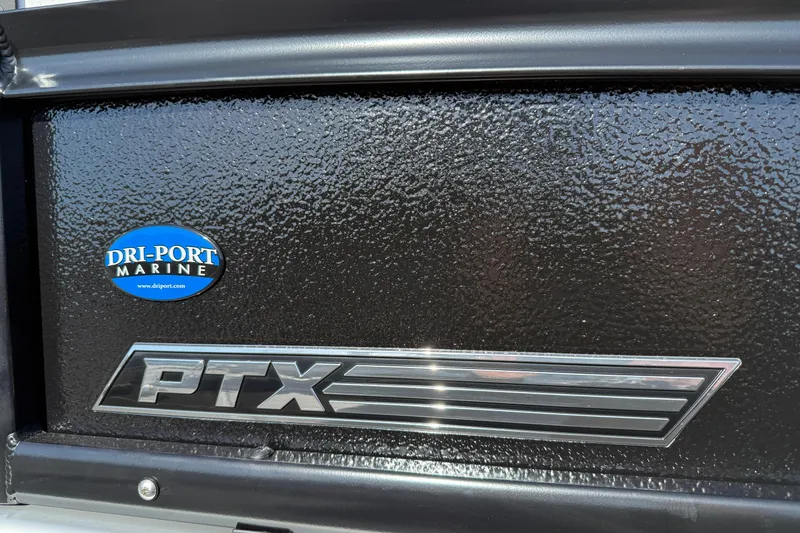 Slide: The Image of Close-up of 2026 Premier 230 SunSation RF PTX logo with Dri-Port Marine sticker. - 28