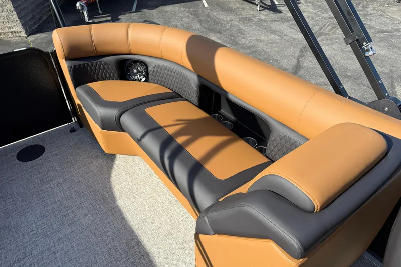 Slide: The Image of Luxurious seating on 2026 Premier 230 SunSation RF boat, featuring tan and black upholstery. - 24