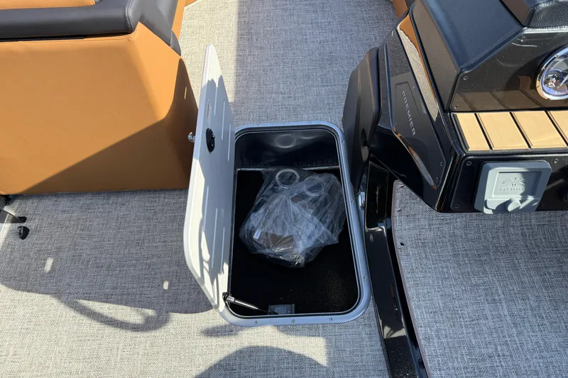 Slide: The Image of Open storage compartment on 2026 Premier 230 SunSation RF boat, showcasing interior space. - 22