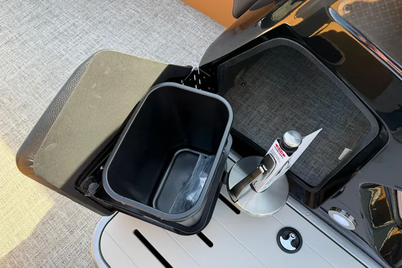 Slide: The Image of Interior view of 2026 Premier 230 SunSation RF boat with storage compartment and accessories. - 21