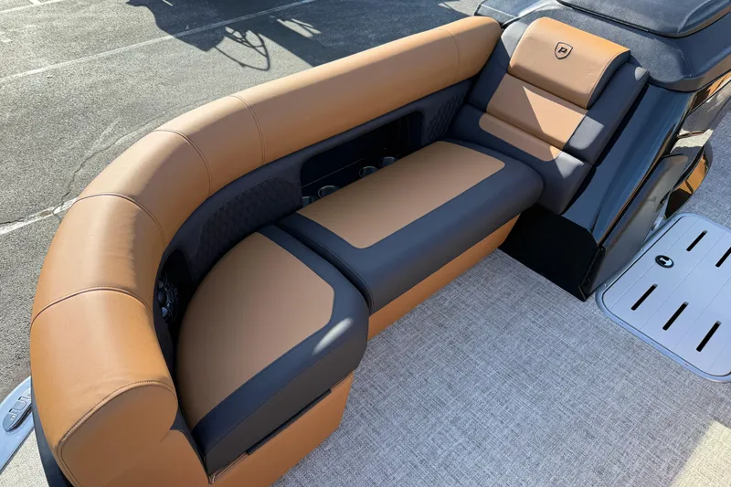 Slide: The Image of Luxurious seating on 2026 Premier 230 SunSation RF boat, featuring tan and black upholstery. - 7