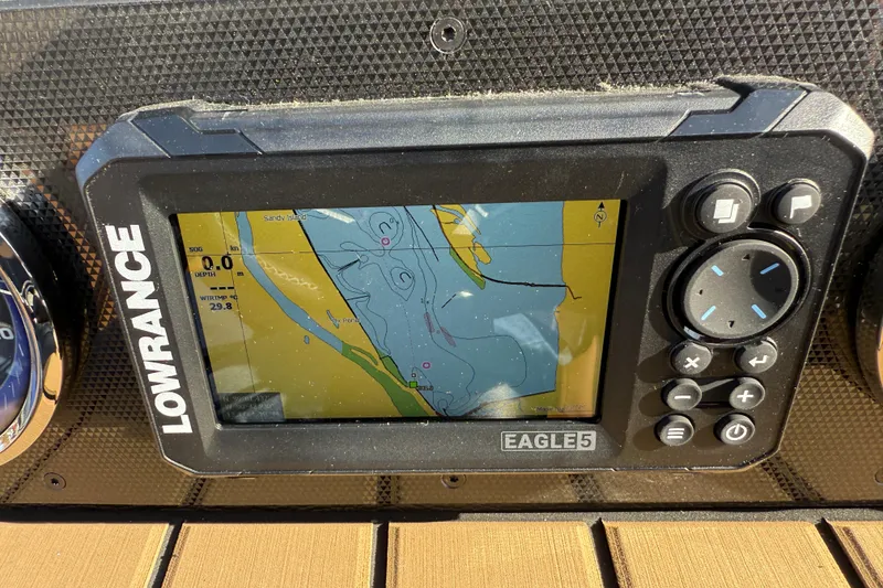 Slide: The Image of Lowrance Eagle5 GPS display on 2026 Premier 230 SunSation RF boat dashboard. - 13