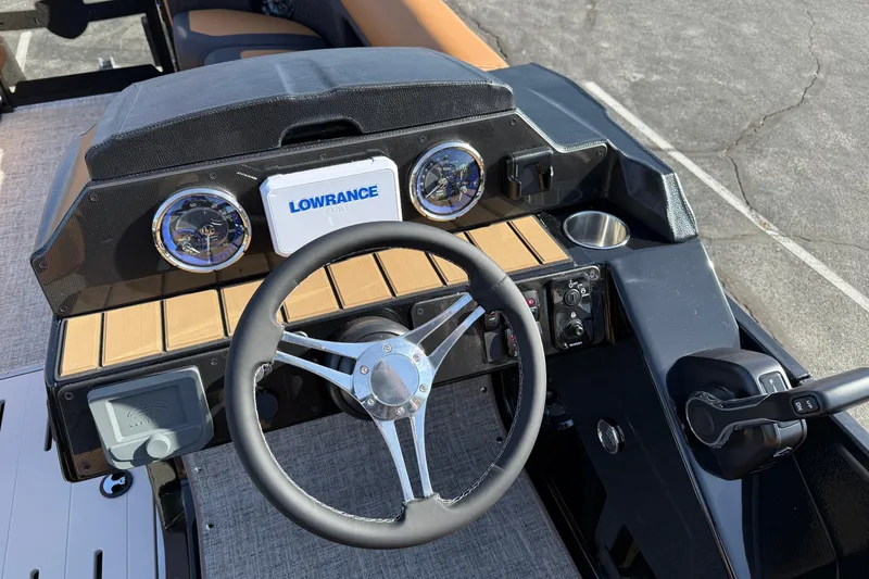 Slide: The Image of Steering console of 2026 Premier 230 SunSation RF boat with Lowrance electronics. - 9