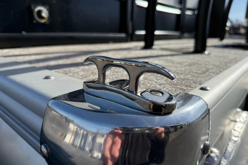 Slide: The Image of Close-up of a cleat on a 2026 Premier 230 SunSation RF boat deck. - 34