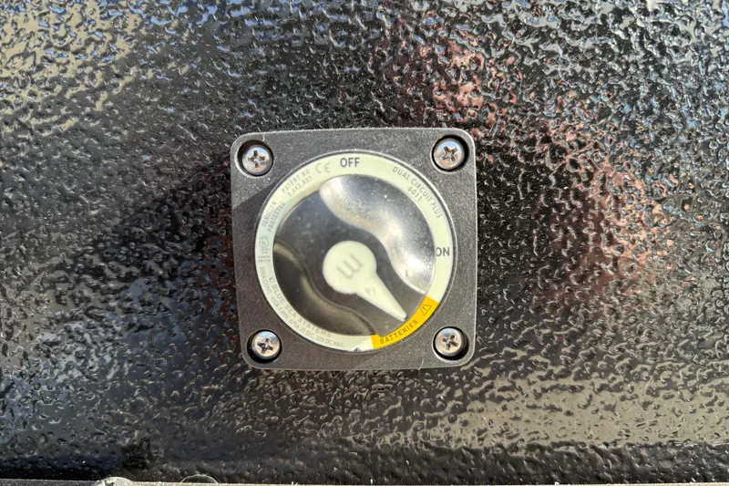 Slide: The Image of Close-up of a control switch on a 2026 Premier 230 SunSation RF boat. - 33