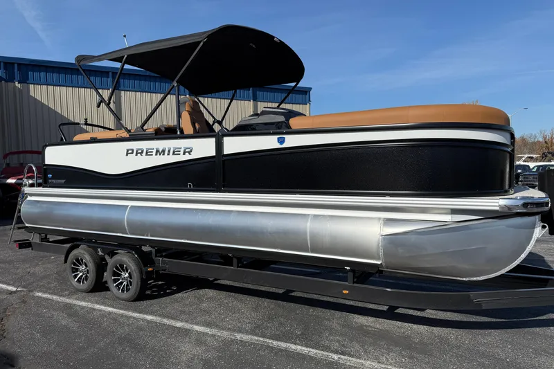 The Image of 2026 Premier 230 SunSation RF pontoon boat on trailer, featuring sleek design and canopy. - 1