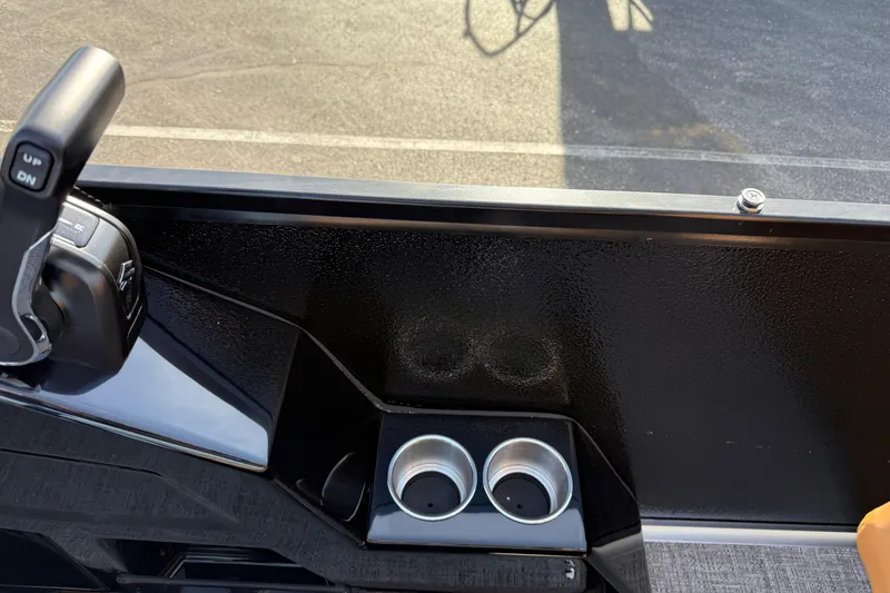 Slide: The Image of Control panel and cup holders on 2026 Premier 230 SunSation RF boat. - 19