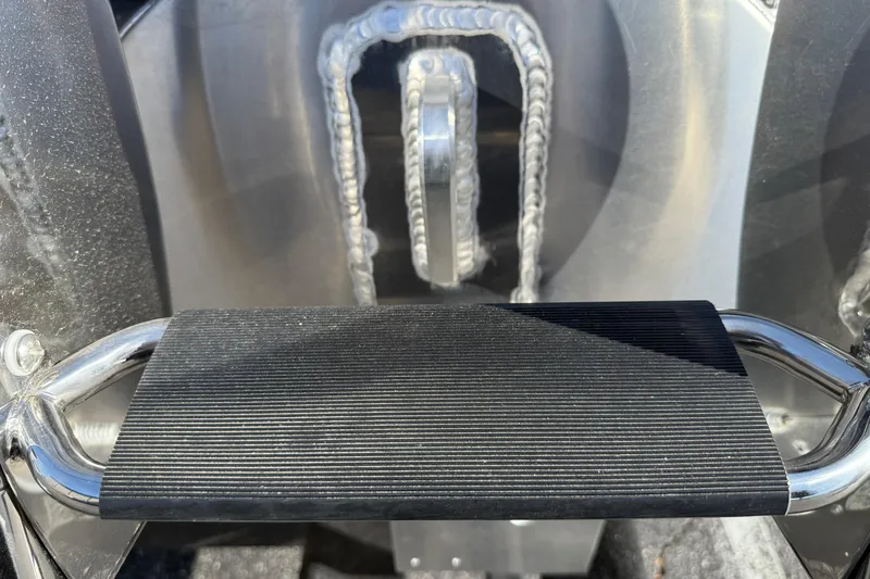 Slide: The Image of Close-up of a 2026 Premier 230 SunSation RF boat's sturdy metal step with textured grip. - 31