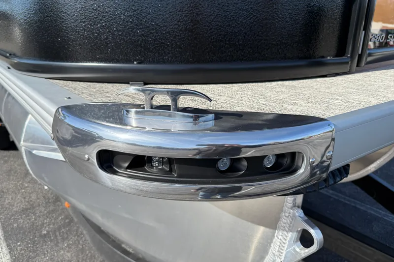 Slide: The Image of Close-up of 2026 Premier 230 SunSation RF boat's sleek metallic cleat and lighting detail. - 36