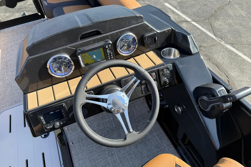 Slide: The Image of Steering console of 2026 Premier 230 SunSation RF boat with modern controls and gauges. - 18