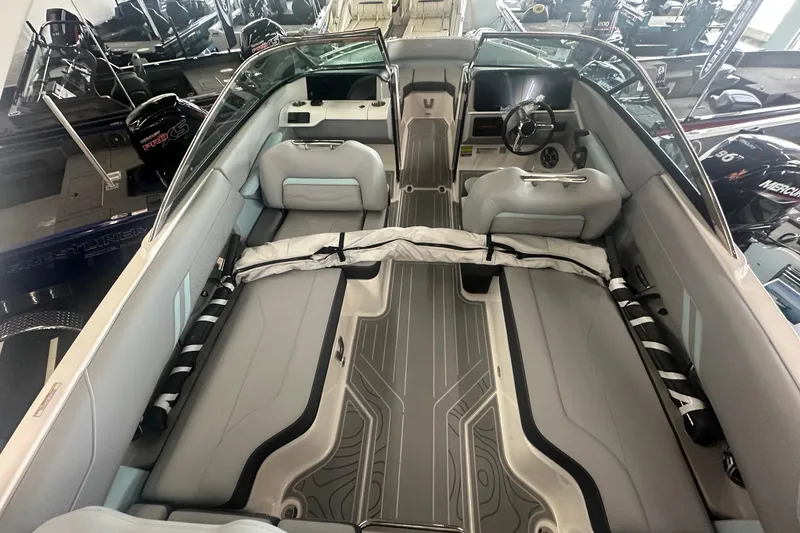 Slide: The Image of 2026 Regal LS4 boat interior with sleek seating and modern dashboard design. - 7