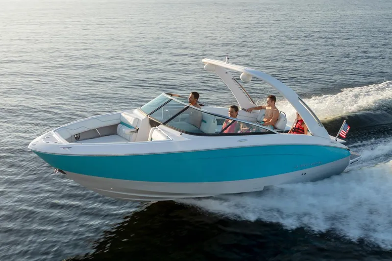 Slide: The Image of Manufacturer Provided Image: 2026 Regal LS4 boat cruising on open water with passengers enjoying the ride. - 11