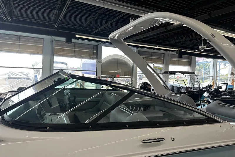 Slide: The Image of 2026 Regal LS4 boat in showroom, featuring sleek design and modern interior. - 5