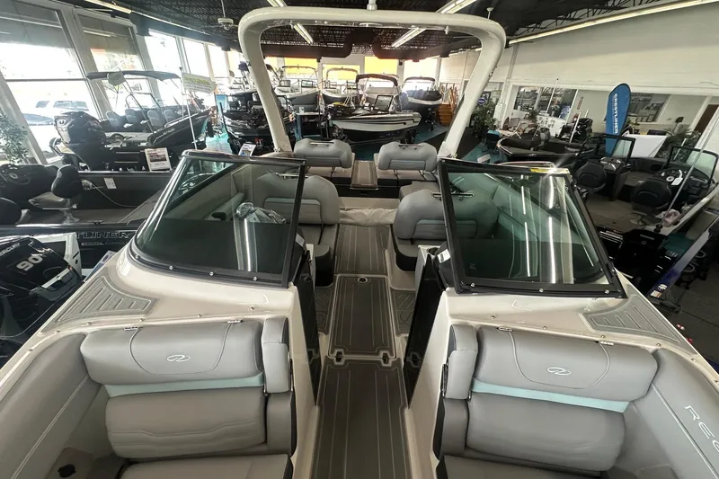 Slide: The Image of 2026 Regal LS4 boat interior with sleek seating, displayed in a showroom. - 3