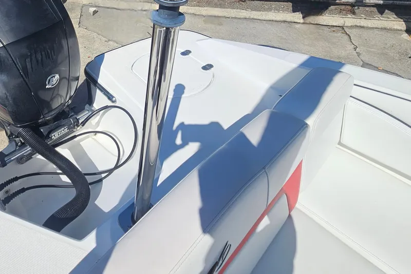 Slide: The Image of 2015 Monterey 197 Blackfin boat interior with engine and seating area. - 7