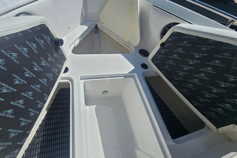 Slide: The Image of Open storage compartments on a 2015 Monterey 197 Blackfin boat deck. - 25