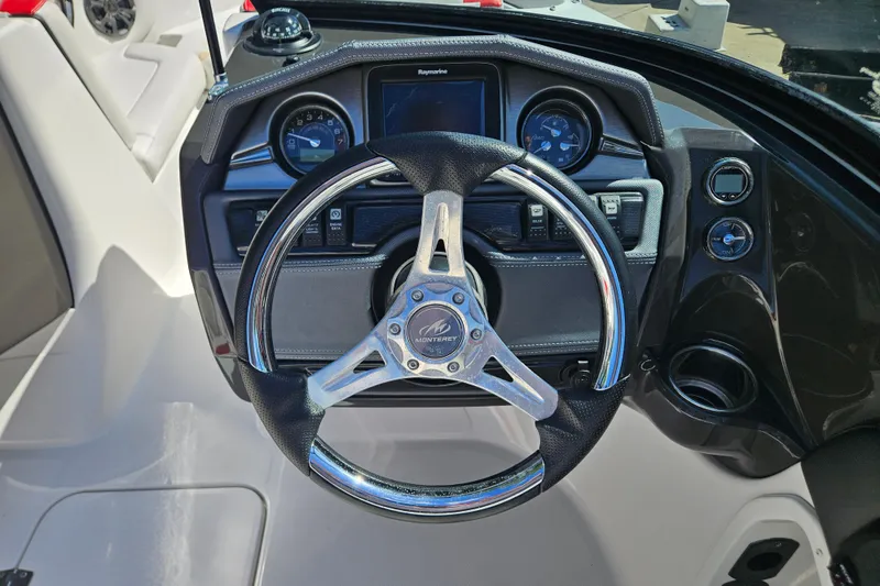 Slide: The Image of Steering wheel and dashboard of a 2015 Monterey 197 Blackfin boat. - 14
