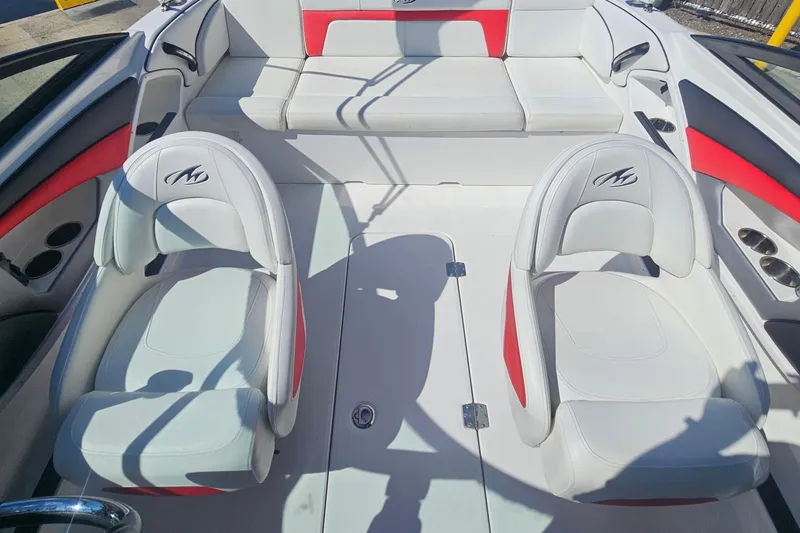 Slide: The Image of Interior of a 2015 Monterey 197 Blackfin boat with white and red seating. - 10