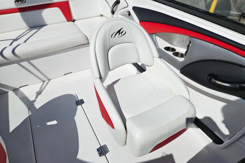 Slide: The Image of White and red interior of a 2015 Monterey 197 Blackfin boat, featuring cushioned seating. - 12