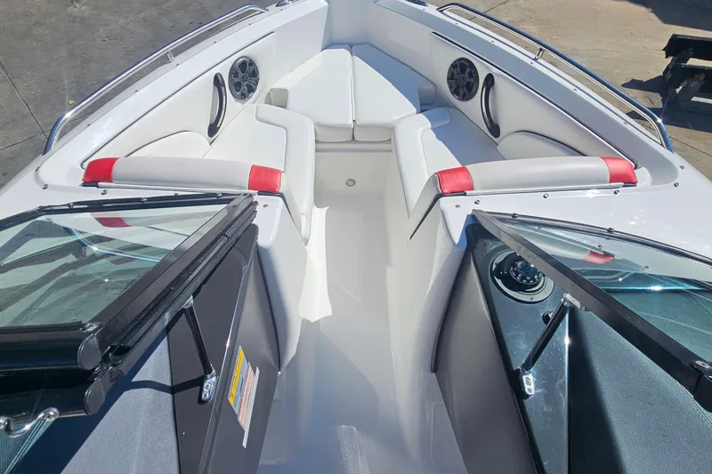 Slide: The Image of 2015 Monterey 197 Blackfin boat interior with white seating and red accents. - 15