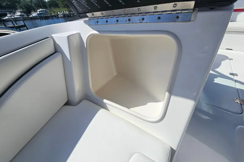 Slide: The Image of 2015 Monterey 197 Blackfin boat storage compartment, open and empty, with white interior. - 17