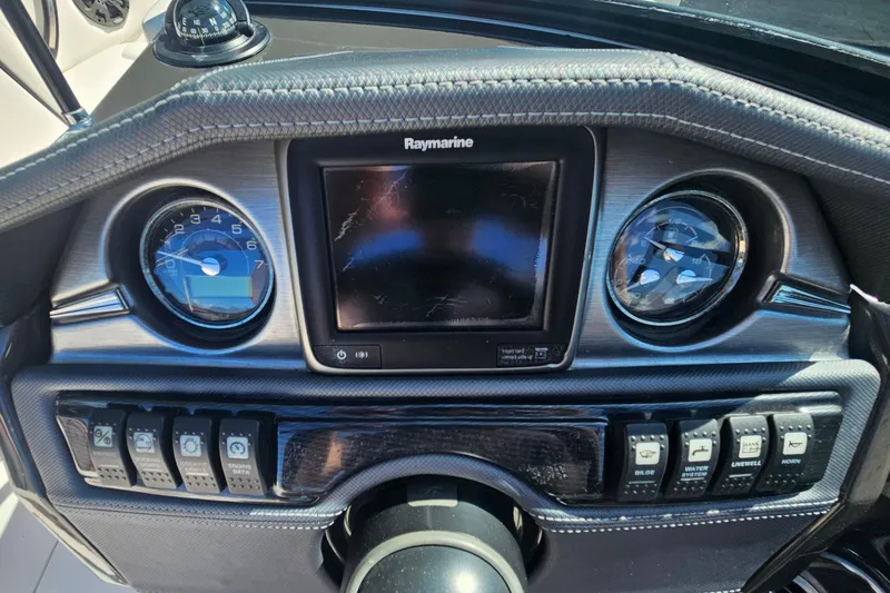 Slide: The Image of Dashboard of a 2015 Monterey 197 Blackfin boat with gauges and controls. - 23