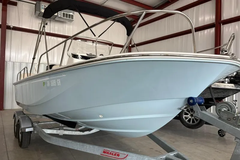 Slide: The Image of 2022 Boston Whaler 190 Montauk boat on trailer in indoor storage facility. - 15