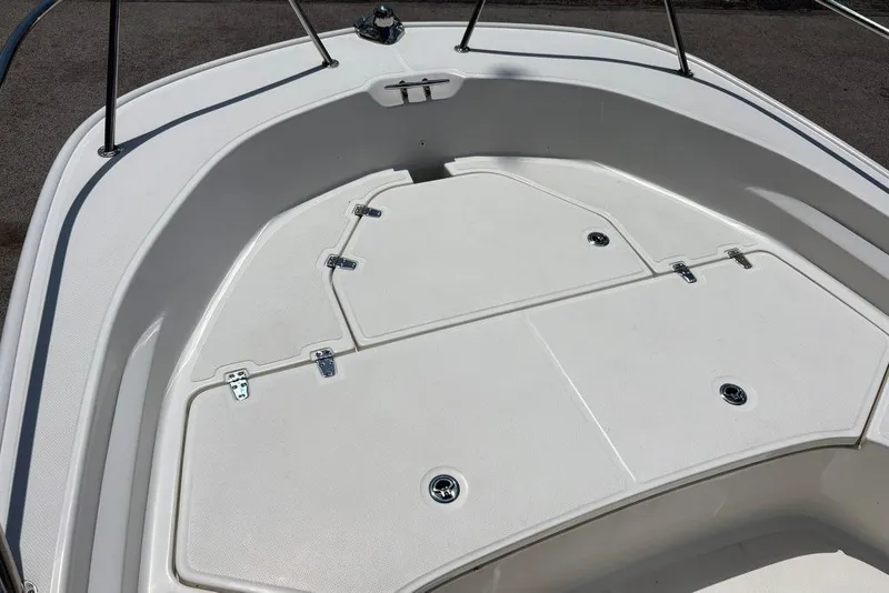 Slide: The Image of 2022 Boston Whaler 190 Montauk boat deck with storage compartments. - 11