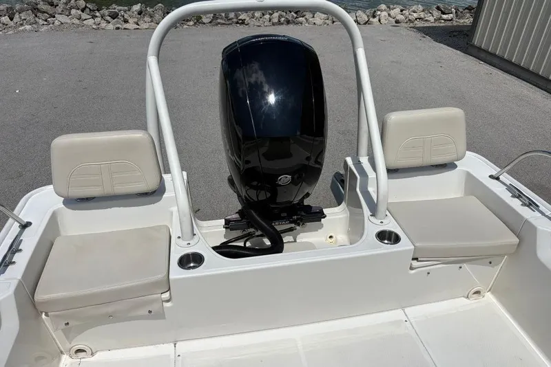 Slide: The Image of 2022 Boston Whaler 190 Montauk boat with outboard motor and seating. - 21
