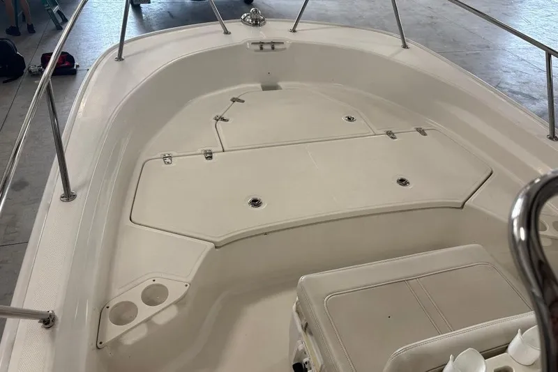 Slide: The Image of 2022 Boston Whaler 190 Montauk boat interior with storage compartments and seating. - 22
