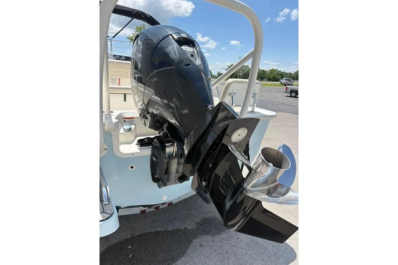 Slide: The Image of 2022 Boston Whaler 190 Montauk boat engine and propeller under clear sky. - 19