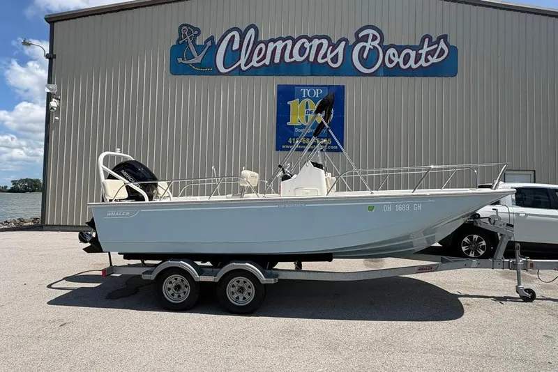 Slide: The Image of 2022 Boston Whaler 190 Montauk boat on trailer at Clemons Boats dealership. - 2