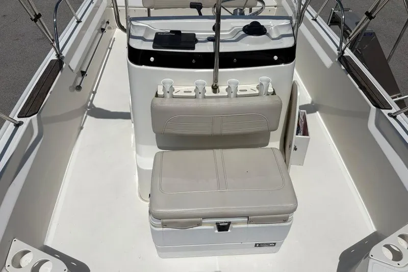 Slide: The Image of 2022 Boston Whaler 190 Montauk boat interior with seating and console. - 12