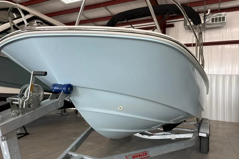 Slide: The Image of 2022 Boston Whaler 190 Montauk boat on trailer in indoor storage facility. - 18