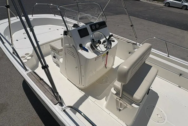 Slide: The Image of 2022 Boston Whaler 190 Montauk boat interior with steering console and seating. - 10