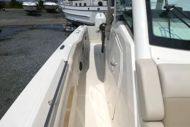 Slide: The Image of 2027 Boston Whaler 360 Outrage boat interior, featuring sleek design and comfortable seating. - 16