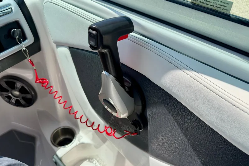 Slide: The Image of Throttle control lever in a 2020 Regal 21 OBX boat interior. - 19